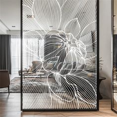 an artistic glass screen in the middle of a room