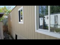 an outside view of a house with the door open