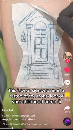 someone has drawn a house on their arm