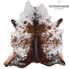 a brown and white cowhide rug on a white background