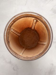 an overhead view of a blender filled with liquid