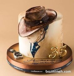 a birthday cake with a cowboy hat on it's top and the number 35