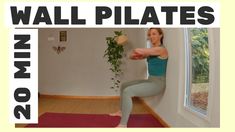 a woman is doing yoga in front of a window with the words wall pilates