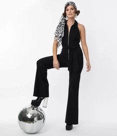 1970s Outfit Inspiration | 70s Costume Ideas Smak Parlour Black Front Zipper Halter Jumpsuit $98.00 AT vintagedancer.com 70’s Fashion Disco, 70s Costume Ideas, Seventies Jumpsuit, Disco Party Outfit Ideas, 1970s Jumpsuit Women, 1970s Fitted Full Length Pants, 70s Sequin Jumpsuit, 1970s Jumpsuit