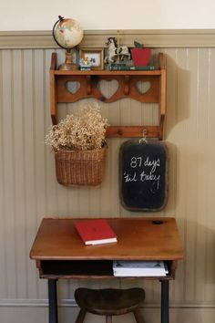 a wooden desk with a chalkboard on it