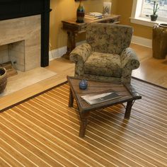 a living room filled with furniture and a fire place next to a wooden coffee table