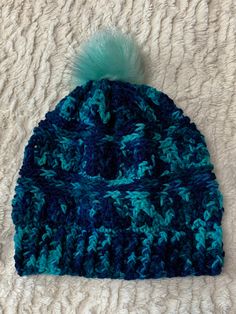 Crochet beanie in shades of blue with light blue faux fur pompom. Blue Winter Beanie, Blue Acrylic Hat, One Size Fits All, Blue Acrylic Hat, One Size, Blue Acrylic Hat One Size, Blue Acrylic Hat, Warm Blue Beanie For Winter, Blue Warm Beanie One Size, Warm Blue Beanie One Size, Blue Beanie For Winter