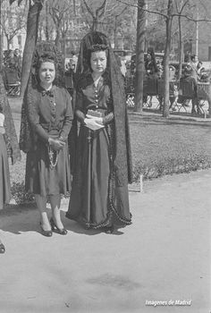 an old photo of three women dressed up in historical clothing standing next to each other