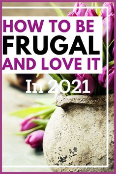 a vase filled with purple flowers sitting on top of a table next to a sign that says how to be frugal and love it