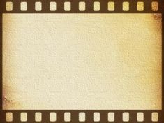 an old film strip with some white squares on the edges and one brown stripe at the end