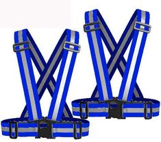 two blue and white reflective safety harnesses with black buckles on each side, one has an adjustable belt