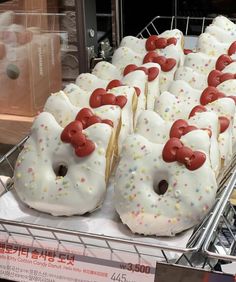 there are many donuts with white frosting and sprinkles on them