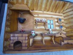 a wood carving of a kitchen with an oven and stove