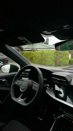 the interior of a car with dashboard and steering wheel