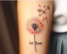 a woman's arm with a dandelion tattoo that says, let them