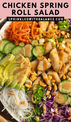 chicken spring roll salad on a plate with coleslaw, carrots and cucumbers