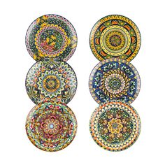 four plates with different designs on them, each painted in different colors and sizes to look like