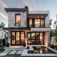 a modern house with an outdoor pool in the front yard