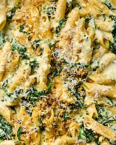 pasta with spinach and parmesan cheese in a bowl