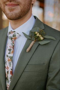 a man in a suit with a boutonniere on his lapel