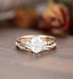 a close up view of a diamond ring on a table