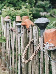 a wooden fence with some lights on it