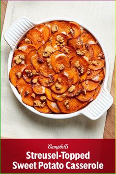 sweet potato casserole with nuts in a white dish