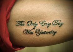 a tattoo saying the only easy day was wednesday