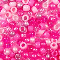 pink and white beads are shown in close up