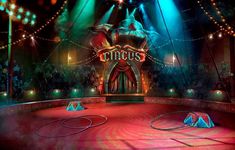 the circus stage is lit up with colorful lights