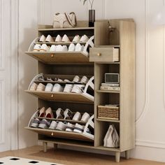 a wooden shoe rack filled with lots of shoes