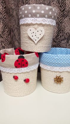 three little baskets with ladybug designs on them