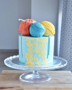 there is a cake with yarn on it