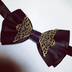 Black satin brass bow tie looks amazing! Total must have!! Adjustable strap, very comfortable to wear. Gold Satin Bow Tie For Black-tie Events, Formal Gold Suit And Tie Accessories With Decorative Bow, Elegant Gold Bow With Ties, Dapper Gold Bow Tie For Formal Occasions, Satin Bow Ties For Party, Satin Bow Ties For Parties, Gold Elegant Bow With Tie Back, Gold Dapper Bow Tie For Formal Occasions, Classic Gold Bow With Bow Tie Back