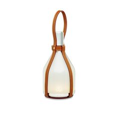 a white and brown glass bottle with a leather strap around the neck on a white background