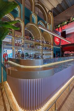 an empty bar with many bottles on the shelves