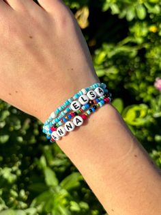 a person wearing a bracelet with words on it