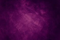 a dark purple background with some stains on it