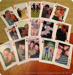 a group of playing cards sitting on top of a wooden table