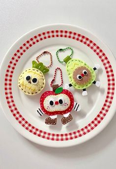 a plate that has some kind of food on it with eyes and hands in the shape of an apple