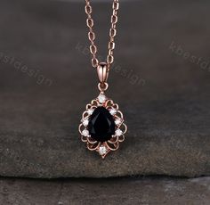 This is a 1.5CT Black Onyx Necklace. For those who are looking for black onyx jewelry which is handcrafted in details, this unique black onyx necklace would be a perfect choice for you. Whether it be a Birthday gift for her, an anniversary gift her, or a celebration of yourself, this black gemstone jewelry is the perfect gift from the heart. Details: *6x8mm pear cut Black Onyx *Side stone: Moissanite Chain: 18 Inches length. I accept custom making order. Please contact me if you need this servic Black Gem Jewelry, Onyx Pendant Necklace, Elegant Onyx Drop Jewelry, Black Onyx Pendant Jewelry, Luxury Elegant Onyx Necklace, Elegant Onyx Pendant Necklace, Moissanite Chain, Black Onyx Pendant Crystal Necklace, Black And Gold Necklace