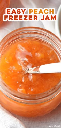 an easy peach freezer jam recipe in a mason jar with a spoon on the side