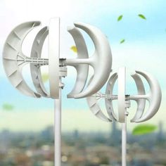 three white wind generators in front of a cityscape with birds flying over them