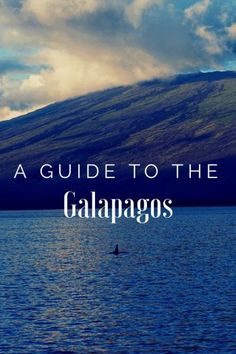 the words guide to the galaagos over a lake with mountains in the background