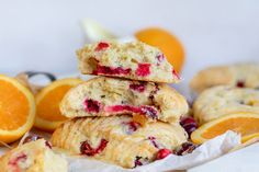 oranges and cranberry scones stacked on top of each other