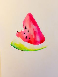 a piece of watermelon sitting on top of a table