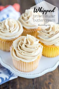 three cupcakes on a white plate with the words whipped brown sugar buttercream