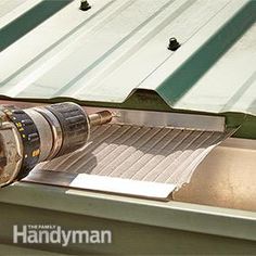 a driller is sitting on top of a piece of metal