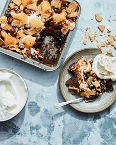 two plates filled with dessert and ice cream