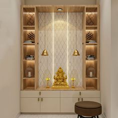 a golden buddha statue sitting on top of a wooden shelf next to a white wall